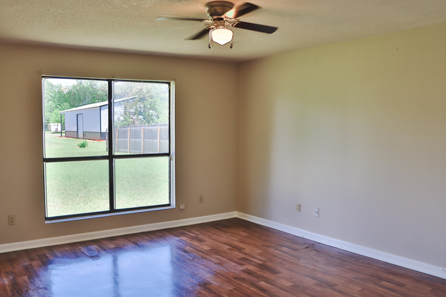 Bright bedroom with large window overlooking backyard at 1512 Lisa Lane Oakdale LA