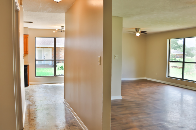 Open den and dining area with sliding glass door to backyard at 1512 Lisa Lane